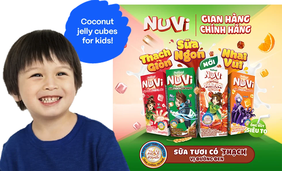 Case study: Coconut jelly cubes for kids (photo). The image features a young boy smiling and sitting next to several jelly cubes. The boy is positioned on the left side of the image, and the jelly cubes are in the background, occupying most of the image's width.